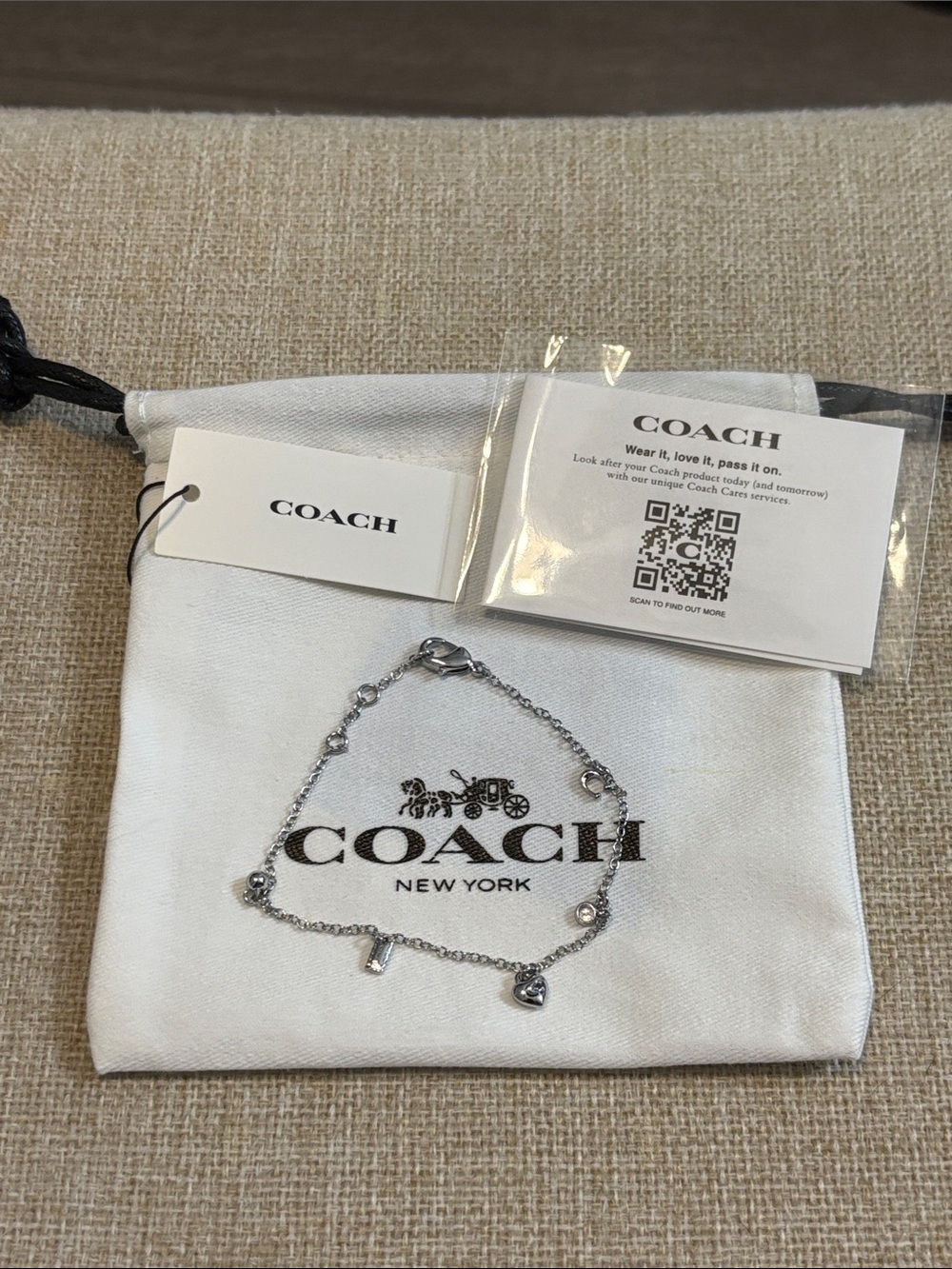 Coach Silver Toned Charm Chain Bracelet with Logo Accents